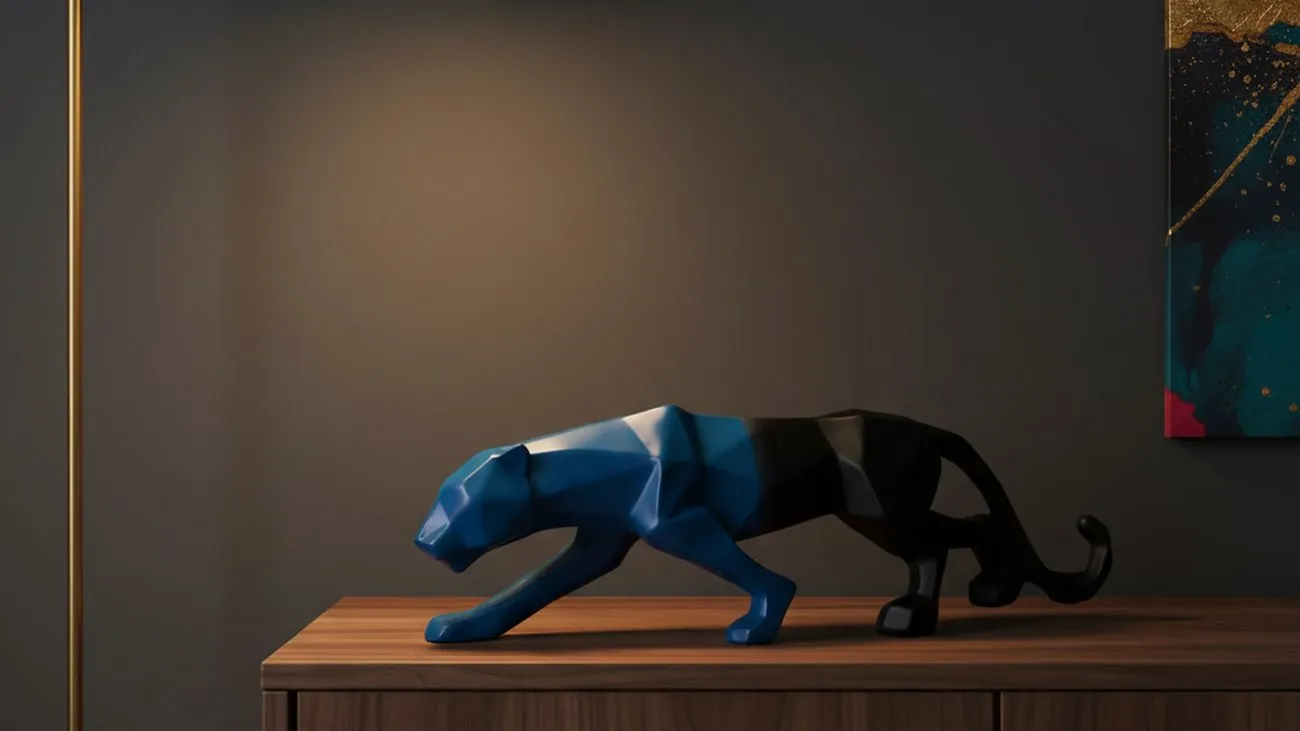 Sleek black panther showpiece with blue accents on dark walnut console table in modern living room